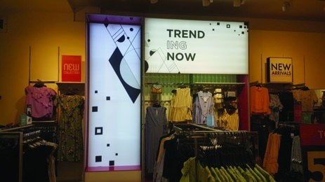 Illuminated fabric light box in a retail store